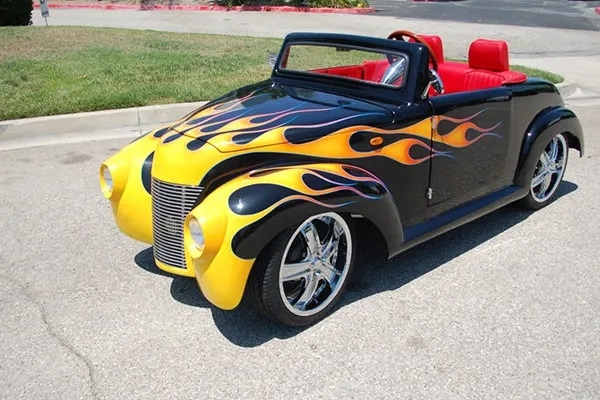 Black 39 Roadster with Yellow Flames affordable golf cart rental, golf cart rent virginia beach